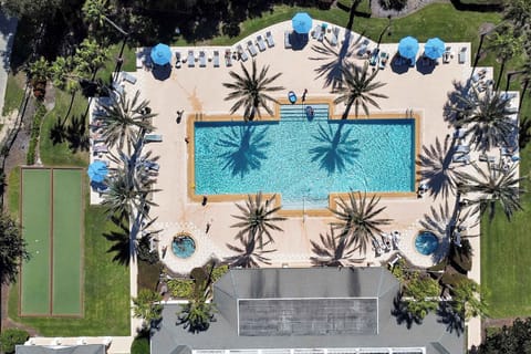 Soak up the sun! 🏖️ Resort-style pool access for a perfect Florida getaway. The main pool area features plenty of loungers and a relaxing hot tub.