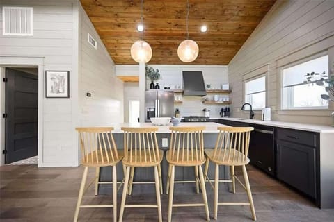 Modern kitchen with sleek finishes spacious island and seating perfect