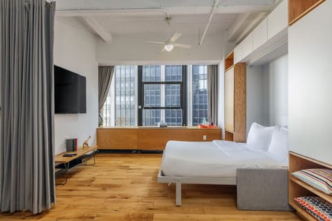 Settle into an airy loft bedroom with room to breathe.