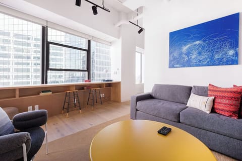 Unwind on the sofa with panoramic windows and lofty ceilings.