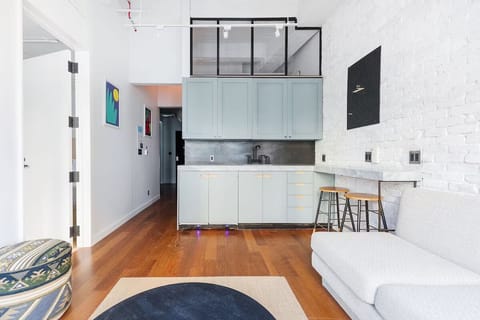 Sip morning coffee at the bar in a chic kitchenette.