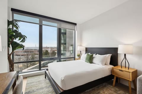 Wake up to sunshine and skyline views from bed.