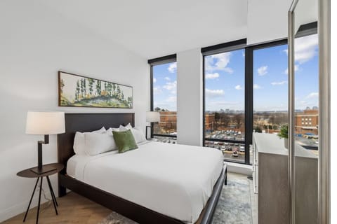 Wake up to sweeping views from this serene king bed.