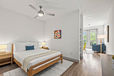 Unwind in crisp linens and airy, sunlit bedroom serenity.