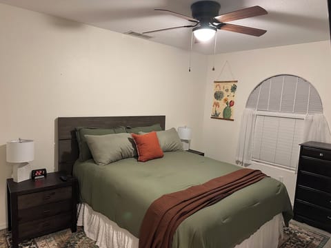 Comfortable Queen bed with bedside charging stations.