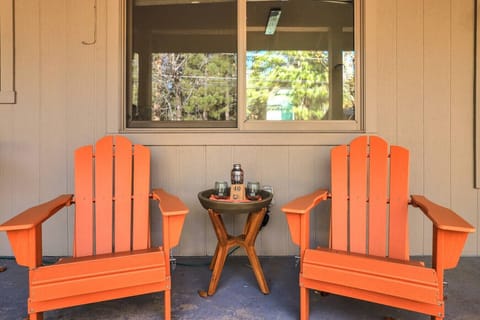 Adirondack chairs under a covered deck