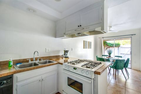 Fully equipped kitchen with all essentials and easy access to dining area.