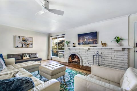 Bright and cozy living room with a charming fireplace and Smart TV