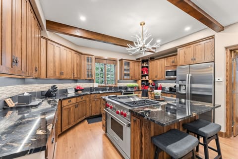 Kitchen: Drip coffee maker, Crockpot, blender, toaster, cooking utensils, tableware