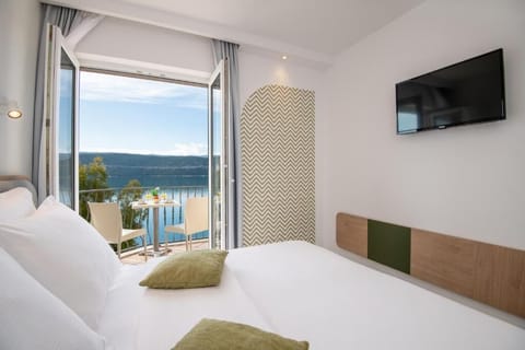 Deluxe Double or Twin Room, Balcony, Sea View | In-room safe, desk, laptop workspace, soundproofing