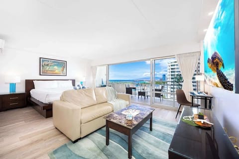 Enjoy your stay in this bright, modern studio at Ilikai featuring a king bed, sleeper sofa, and a private lanai with stunning harbor and ocean views.