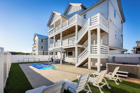 Private heated pool with spacious decks and lake and ocean views.