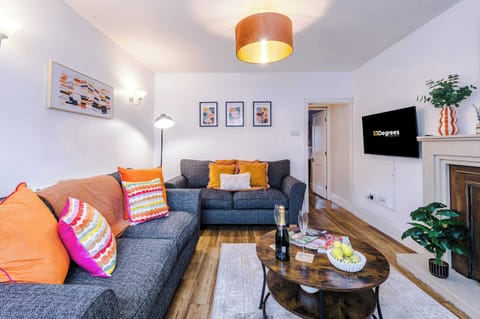 The bright living room provides a comfy space for you to relax, socalise and enjoy the SMART TV. The space is equipped with two plush sofas and soft furnishings to help you feel right at home.