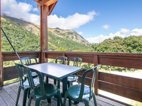 Private balcony with outdoor dining and stunning views over the Valloire valley.