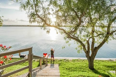 Dockside serenity with fishing access and breathtaking bayfront sunsets.
