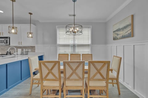 Gather around the table in a bright, airy dining space designed for meals and conversation.