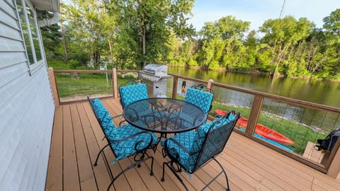 summer dining table on deck
, river view. 