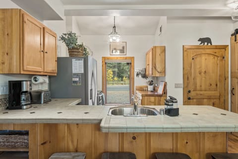 The open concept kitchen is excellent for preparing meals for friends and family.