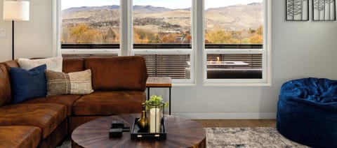 Seamless indoor-outdoor living—three expansive windows frame the Boise Foothills, inviting nature’s beauty into your elegant retreat