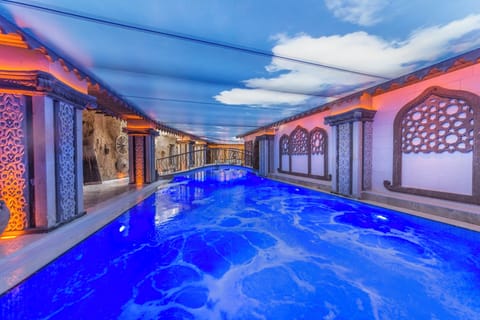 Indoor pool, seasonal outdoor pool, pool umbrellas, sun loungers