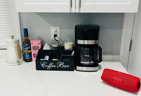 Dedicated coffee and tea station, fully stocked with coffee maker, tea, sugar,..