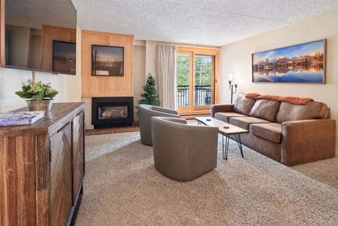 Living Room. Wall-Mounted TV. Fireplace. Balcony.