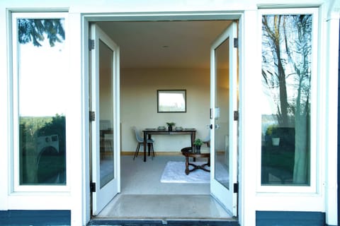 Step through the elegant French doors into an outdoor escape just beyond.