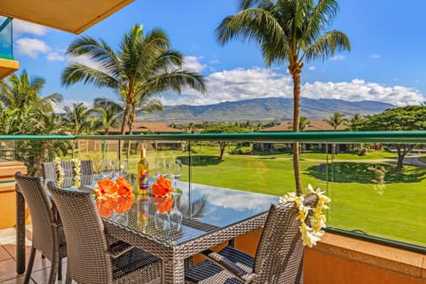 Start your morning on a private balcony with stunning mountain views and a cozy dining setup—perfect for coffee or sunset drinks.