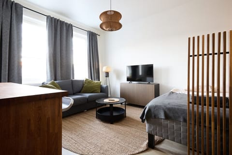 Enjoy a versatile living space that comfortably accommodates up to four guests with a double bed and a cozy sofa bed. The layout is designed to feel spacious and functional for both short and long stays.