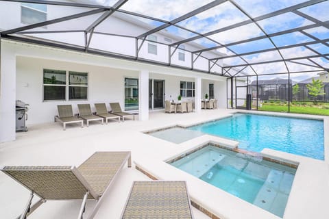 Relax on a sunlounger on your private patio after taking a dip in your backyard swimming pool.