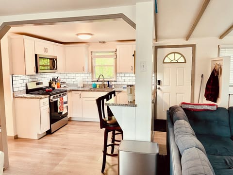 Dining room looking to kitchen and breakfast bar.