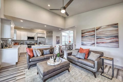 Spacious living area with leather furnishings and a warm, inviting style.