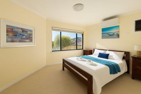 Master bedroom with adjoining full bathroom  on the entrance level. Aircon dual in the bedroom. Lots of natural light too and a spacious room