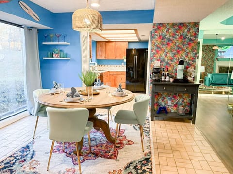 Charming dining setup with ample seating, a coffee bar, and stylish decor.