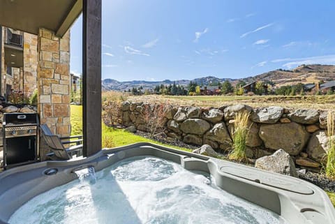 Private hot tub and barbeque grill with mountain views