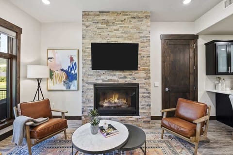 Spacious living room w/fireplace & smart TV