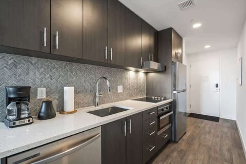 Full size kitchen with new appliances anbd coffee maker