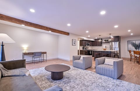 Living room, desk area & kitchen.