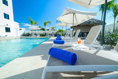 Outdoor pool, open 9:00 AM to 6:00 PM, pool umbrellas, sun loungers