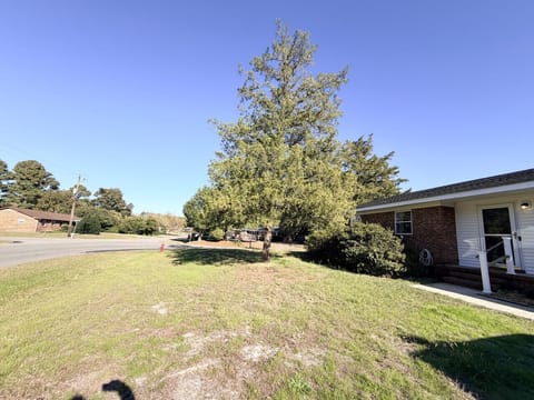 Large corner lot with room to move about