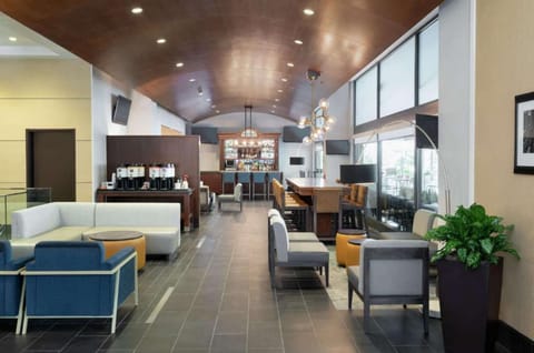Lounge with bar, coffee station, and cozy seating areas