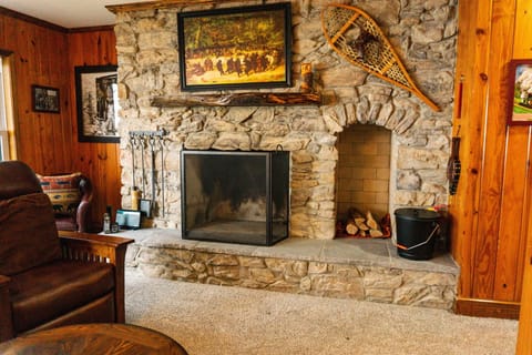 The unique craftsmanship of this wood-burning, natural stone fireplace anchors the room with
undeniable elegance.