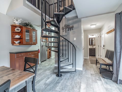 Open concept w/a spiral staircase to access the 2nd floor bedrooms.