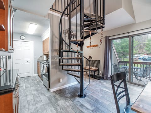 Spacious gathering area leads to patio & kitchen equipped with it all. 