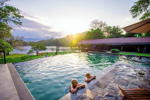 Outdoor pool, open 6:30 AM to 8:00 PM, pool umbrellas