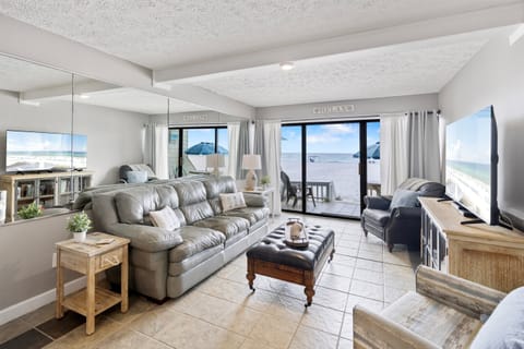 Unwind in your beachfront living room where panoramic ocean views and comfortable seating create the perfect coastal retreat.