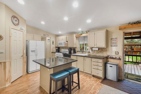 Fully equipped kitchen with pantry is perfect for family gatherings.