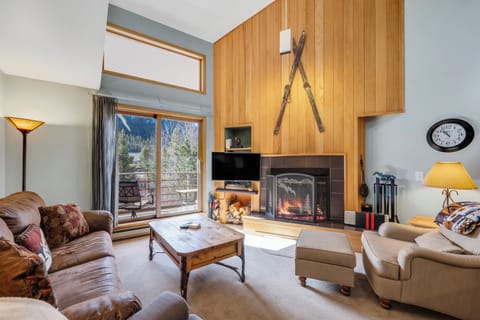 Cozy Living Room with Fireplace and Deck Access