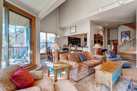 The open-concept living space welcomes natural light and offers plenty of room to relax after a day on the slopes.
