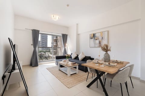 Luxury Apartment, Balcony, City View | Living area | 65-inch Smart TV with cable channels